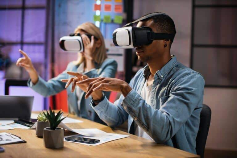 Company workers wearing VR headset during meeting