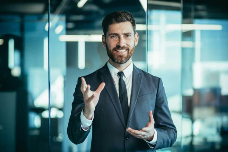 Happy businessman business owner, looking at webcam